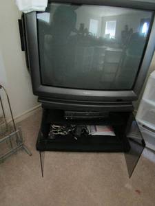 lot 201 image: TOSHINA TELEVISION 32 - BLACK DBL DOOR TY STAND 17 X 29 X18  and  ZENETH VHS  PLAYER W REMOTE