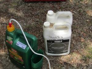 lot 1063 image: GEAR LUBE FOR BRUSH HOG - OPENED , FLOWER BED SPRAY