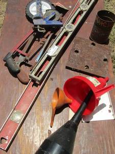lot 946 image: 2 levels handsaws caulking gun and funnels
