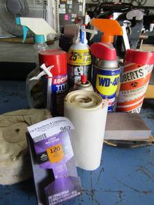 lot 962 image: Faster standing sanding blocks opened WD40 opened tire foam and opened Dpa Tex plus foam sealant