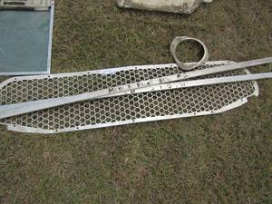 lot 952 image: Aluminum grill and headlight rim