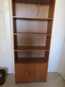 lot 20 image: 4 tier book case bottom Dbl. doors 1 inside shelf 71x30x11