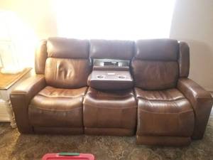 lot 8 image: Brown leather couch with 2 recliner- electronic chair on each end, cup holders, and usb charging station