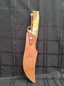 lot 87 image: Colt Hunting Knife with leather sheath and Damascus blade
