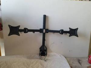lot 219 image: Clamp on desk or table dual monitor holder