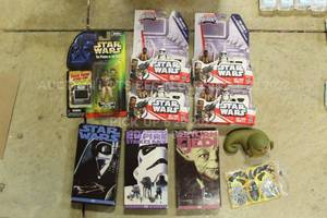 lot 64 image: Lot of 10 Star Wars Action Figures Toys, Movie VHS Set, Buildable and More, Some Brand New Factory Sealed
