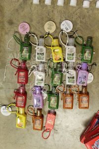 lot 72 image: Lot of 18 Brand New Sealed Good Housekeeping Portable Hand Sanitizers with Keyring  Purse Strap in Various Scents