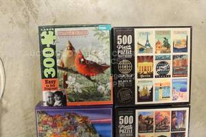 lot 96 image: Lot of 4 Puzzles in Box Ranging from 300 to 1000 Pieces Each