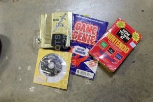 lot 117 image: Nintendo Lot with Gamecube games, ZELDA II NES Nintendo Entertainment System Gold Cartridge, How to Win Nintendo Books, Crash Star Wars Madden, N64 Part Various Untested