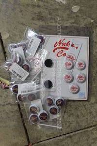 lot 135 image: Fallout Video Game Swag Memorabilia Nuka Cola Quantum Cola Bottlecaps and Nuka Cola Opener