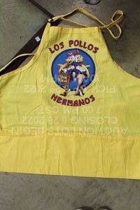 lot 263 image: Los Pollos Hermanos Apron from Breaking Bad, Has Pencil Marks