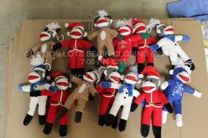 lot 384 image: Lot of 13 Christmas Sock Monkey Plush Plush Retail Defective Pulls