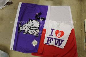 lot 484 image: TCU Memorabilia Flag, Glasses, Sticker, I Heart FW Shirt, TCU Team Store Bag