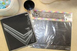 lot 496 image: Five Star 3 Ring Binder With Pencil Holder, Imagination Starters Chalkboard Placemats, Bulk Dominos Cup
