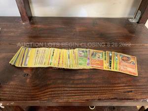 lot 143 image: Lot of 100 Used Pokemon Cards Various Cards in Various Playwear Conditions Trading Card Game TCG