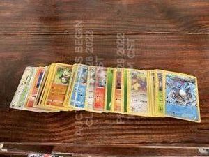 lot 142 image: Lot of 100 Used International Pokemon Cards Various Cards in Various Languages in Various Playwear Conditions Trading Card Game TCG