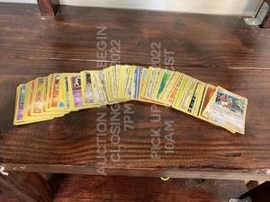 lot 238 image: Lot of 100 Used Pokemon Cards Various Cards in Various Playwear Conditions Trading Card Game TCG