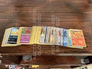 lot 239 image: Lot of 100 Used International Pokemon Cards Various Cards in Various Languages in Various Playwear Conditions Trading Card Game TCG