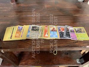 lot 284 image: Lot of 100 Used International Pokemon Cards Various Cards in Various Languages in Various Playwear Conditions Trading Card Game TCG