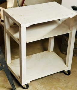 lot 29 image: WOODEN 23x 25x 15.5 ROLL A ROUND TABLE SHELVES wCASTERS&nbsp