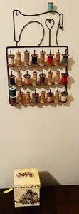 lot 104 image: VINTAGE METAL WALL HANGING THREAD RACK wORNATE BOX OF BUTTONS &amp VINTAGE SPOOLS OF THREAD