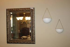 lot 11 image: Framed Beveled Mirror and Hanging Plant Decorations