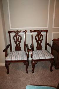 lot 12 image: Pair of Captain Chairs, Dining Chairs with carved woodworking, matches Lots 13,14