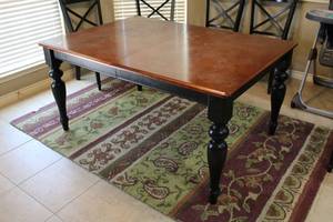 lot 32 image: Kitchen Table, Brown top with black legs, matches Lots 30,31, has two Leaves
