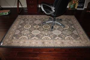 lot 64 image: Area Rug 53 x 77 by Polladio, Black and Cream colors