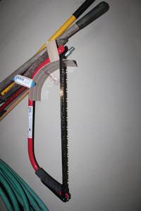 lot 91 image: Yard Tools Rake, Shovel, Bow Saw