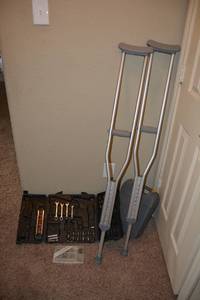 lot 130 image: Tool Kit, Screw Kit, Empty Ryobi Case, and Pair of Crutches