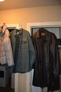 lot 134 image: Coat Lot Beyond California Black Leather Coat Size S, Cabelas XL Jacket, Guess Puffy Grey Jacket