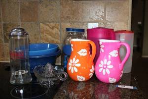 lot 20 image: Glass and Plastic Pitchers, Glass Juicer, Coca-Cola Straw Holder, and Plastic Mixing Bowls