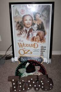 lot 154 image: Wizard of Oz Framed Poster, Theatre Room Sign, Mexico Sombrero, and Battery Operated Love Sign