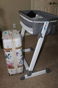lot 143 image: Baby Bassinet Grey and White, and Rolling Hardcase Suitcase (UseResponsibility is sole discretion of Buyer)
