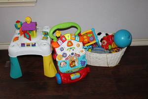 lot 176 image: Toddler Vtech Walker, Stand and Basket of Toys