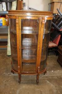 lot 4 image: Antique Oak Rolling Curio Cabinet