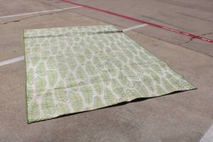 lot 14 image: Green and White Leaf Outdoor Area Rug, 7ft. X 10ft.