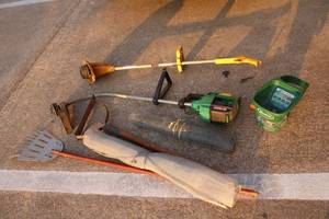 lot 135 image: Yard Tools Weed Eaters, Hand Spreader, Hoes, Wire Mesh