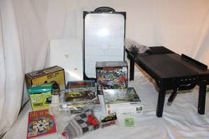 lot 150 image: Puzzles and Games Plus Charging Stand with light