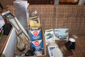 lot 173 image: Car Parts and Tools Headlamps, Tool Belt, Bathtub Assembly Kit, Weighted Cup Holder, and Classic Car Photos