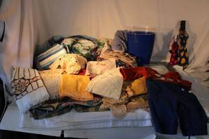 lot 174 image: Shower Curtain, 2 Small Rugs,  Placematslinens, 36 month Baby outfit, Scale Umbrellas, and Trash Can