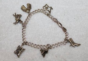 lot 234 image: Silver .925 Jewelry Charm Bracelet with Western Style Charms