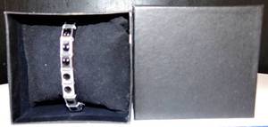 lot 208 image: PRETTY SILVER FINISH REVERSIBLE STRETCH WRIST BRACELET