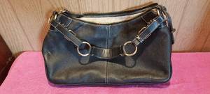 lot 67 image: Dooney & Bourke all leather purse