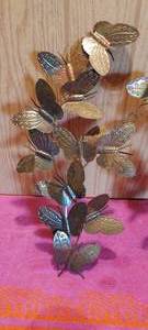 lot 69 image: Tin butterfly wall hangings