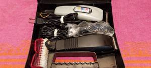 lot 92 image: Pair of clippers with heads, brush and case untested