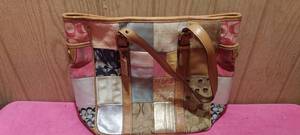 lot 210 image: Authentic Coach purse with leather handles and bottom