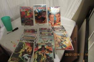lot 141 image: DC COMICS EARTH 2 SOCIETY COMIC BOOKS IN PLASTIC SEE DESCRIPTION