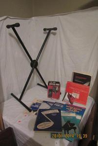 lot 148 image: KEYBOARD  X-STAND , GUITAR GREAT WALL HOOK, GUITAR CD, AND BOOKS